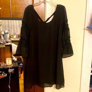 Long sleeve, half-open back flowy black dress